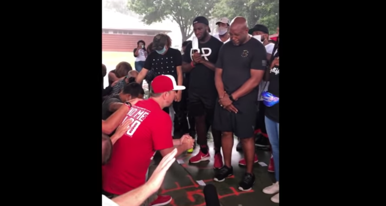 White people kneel and ask for forgiveness from black community at George Floyd prayer gathering