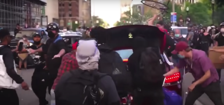 Police release video of protesters attacking disabled man’s car