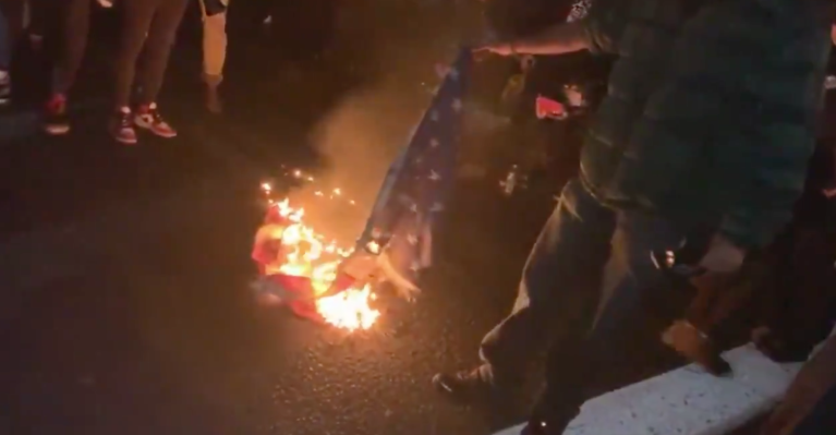 Rioters seen burning American flag during Washington state protests
