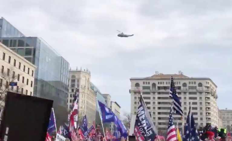 Thousands of Trump supporters sing national anthem and cheer as president passes overhead on Marine One