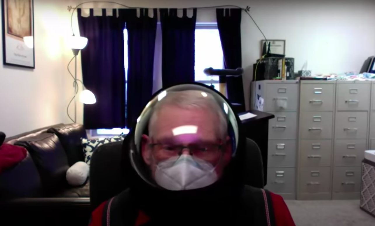 Fishbowl helmet-wearing professor placed on leave over profanity-laced rant about COVID-19