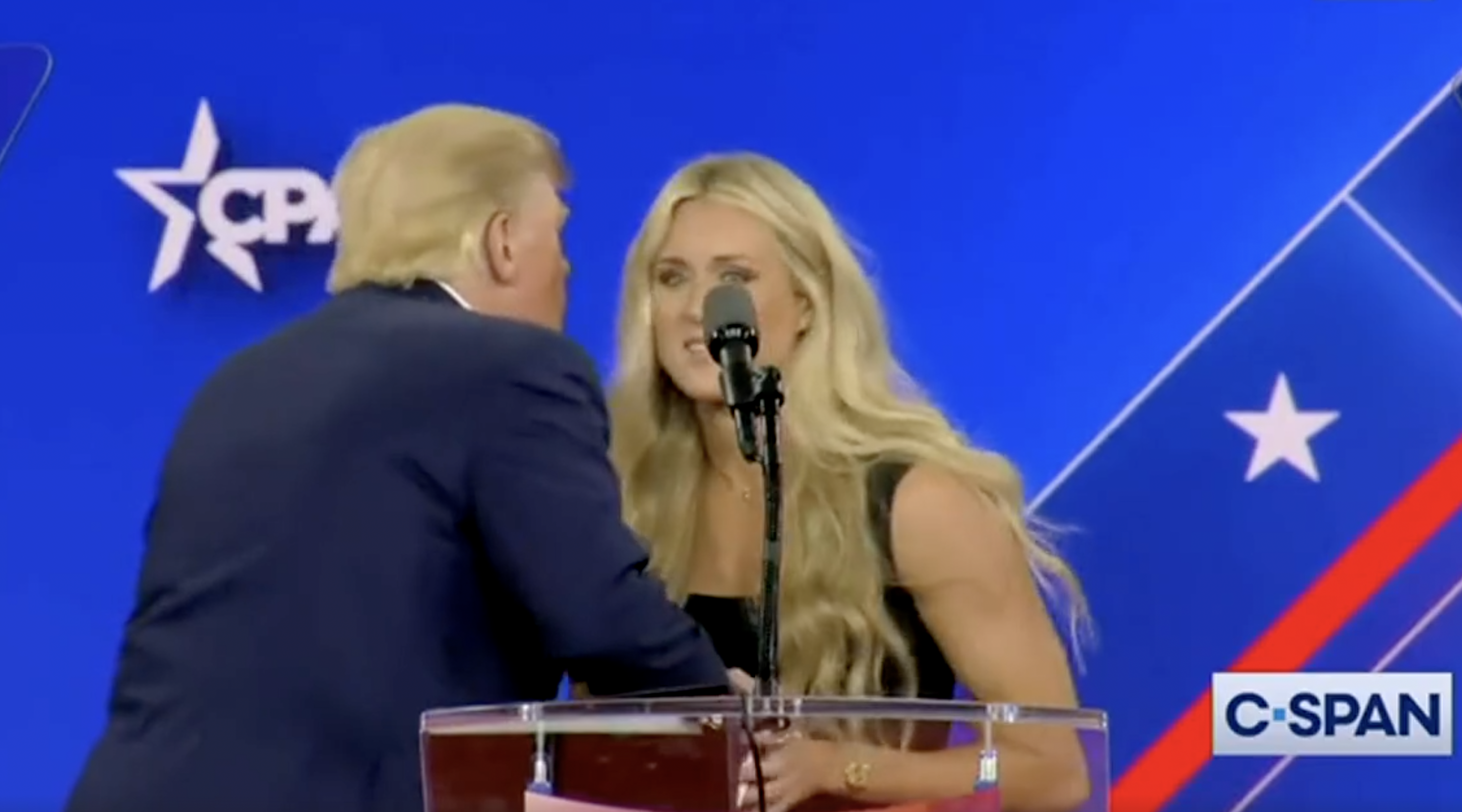 WATCH: Swimmer Riley Gaines dodges Trump as he tries to kiss her on stage