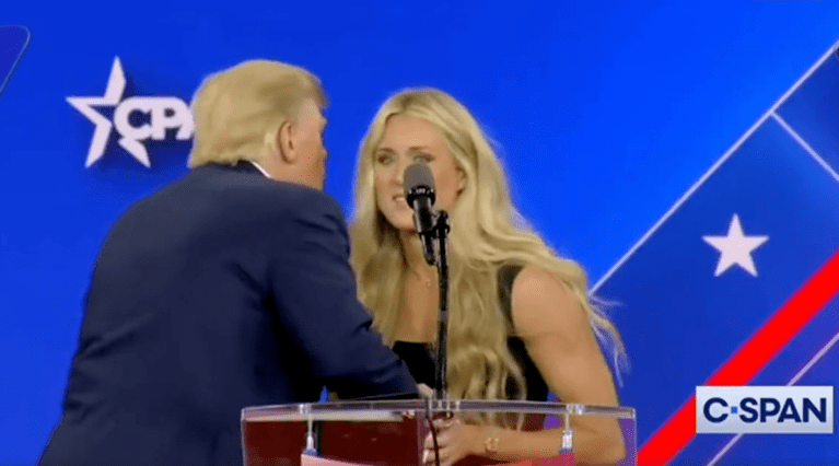 WATCH: Swimmer Riley Gaines dodges Trump as he tries to kiss her on stage