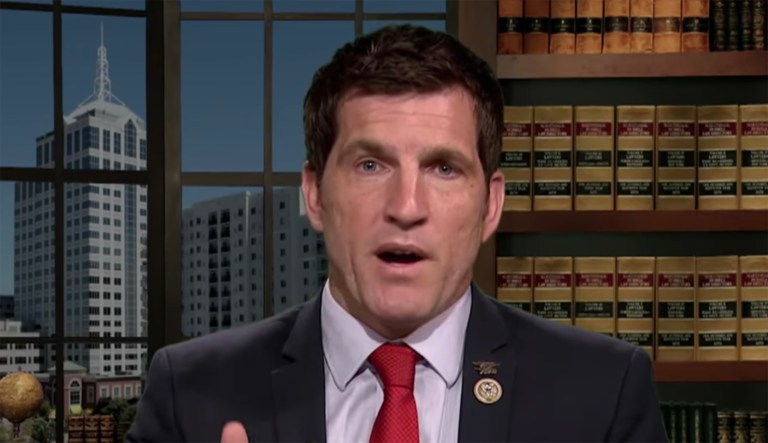 Rep. Scott Taylor, R-Va., speaks during a television interview.