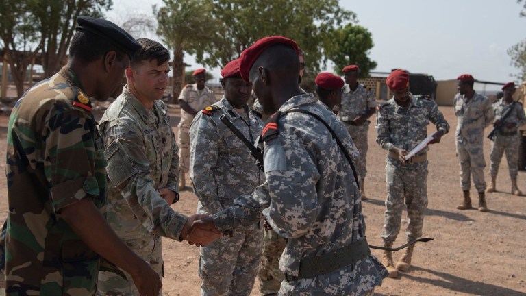 U.S. Army Lt. Col. Jon Anderson, U.S. Army Africa Security Forces Assistance Brigade (SFAB) commander, shakes the hand of a soldier from the Djiboutian National Armyâs Rapid Intervention Battalion (RIB) before receiving a certificate for completing a week of training Sept. 3, 2020.