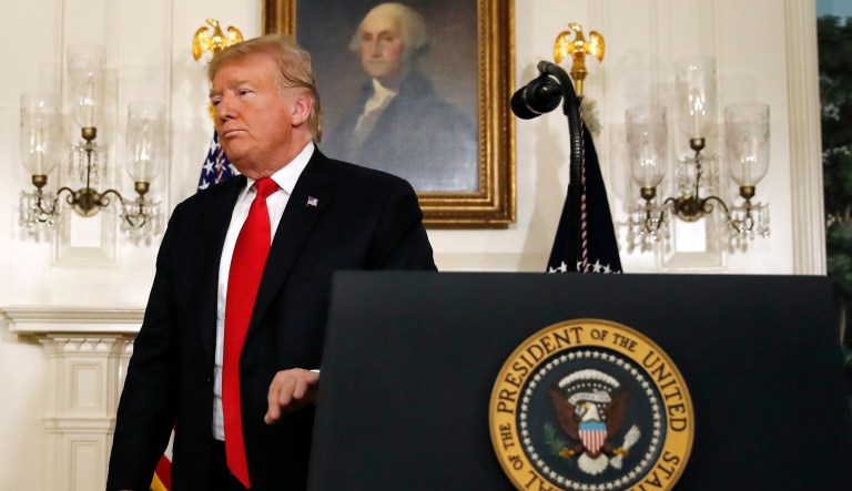 President Donald Trump leaves the podium after speaking about the partial government shutdown, immigration and border security in the Diplomatic Reception Room of the White House, in Washington, Saturday, Jan. 19, 2019.