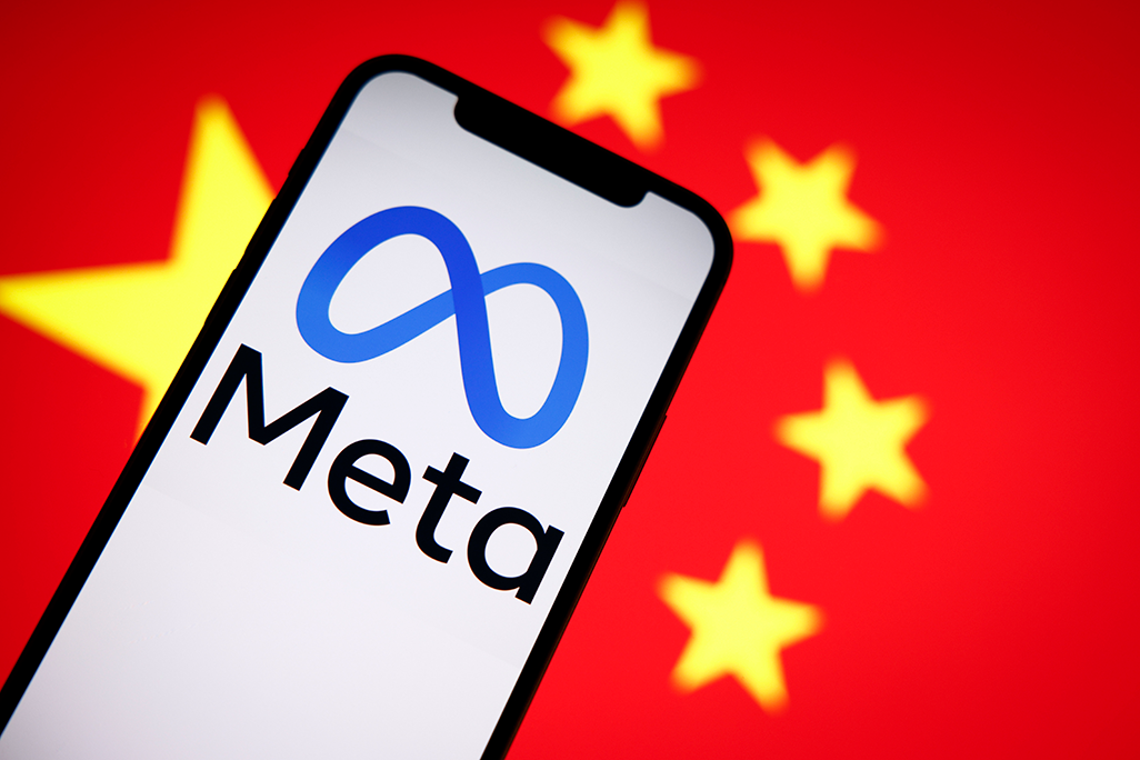 The Meta logo is seen on a mobile phone with the Chinese flag in the background in this photo illustration in Warsaw, Poland, on Sept. 27, 2022.