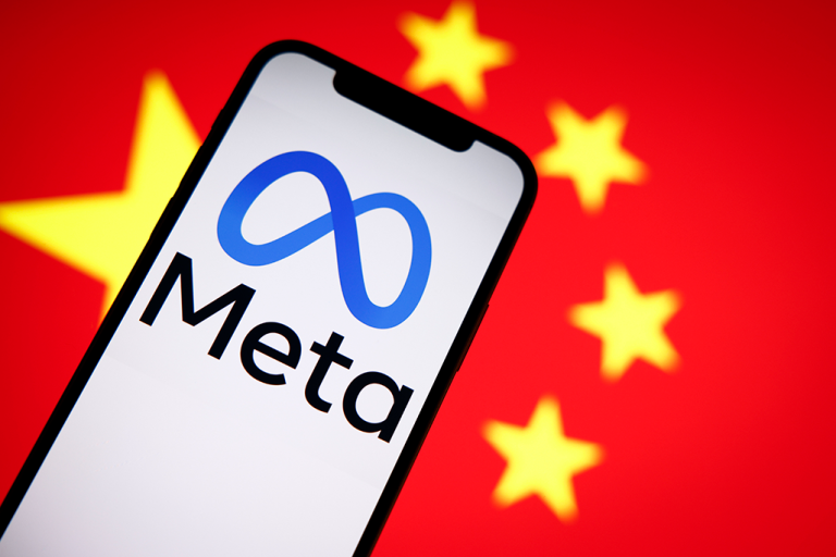 The Meta logo is seen on a mobile phone with the Chinese flag in the background in this photo illustration in Warsaw, Poland, on Sept. 27, 2022.