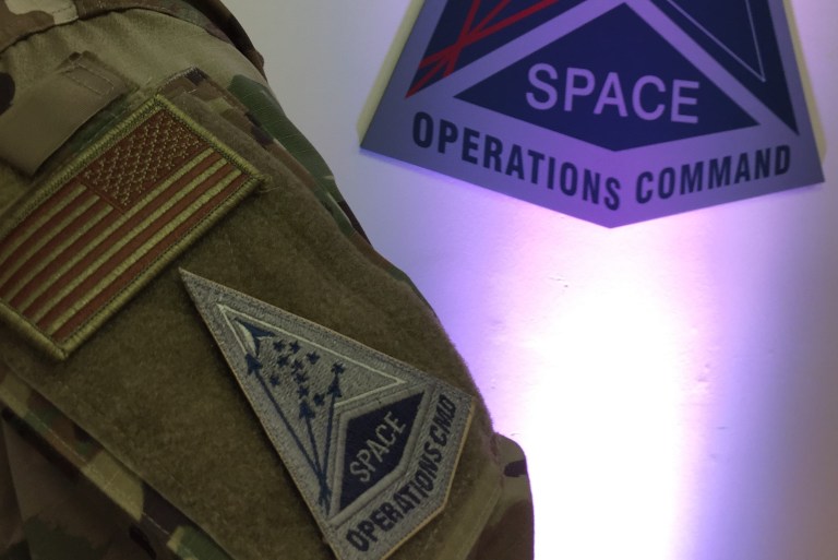 Air Force Capt. Christopher Merian, administratively assigned to the U.S. Space Force, shows off the patch representing the service's first field command, Space Operations Command (SpOC) on October 21, 2020.