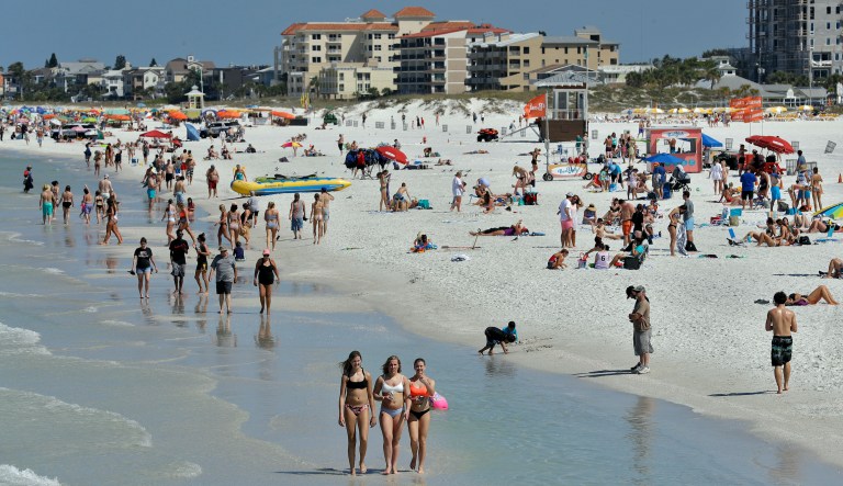 California university offers $75 payment to students not traveling for spring break Visitors enjoy Clearwater Beach, Wednesday, March 18, 2020, in Clearwater Beach, Fla. Beach goers are keeping a safe distance from each other to help protect from the spread of the Coronavirus.