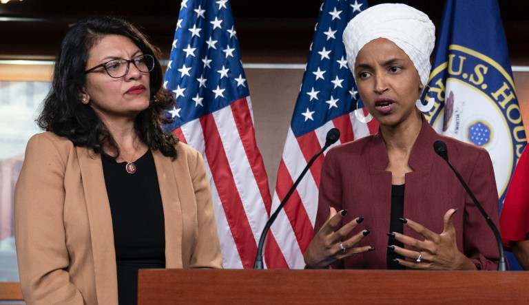 In this Monday, July 15, 2019, file photo, U.S. Rep. Ilhan Omar, D-Minn, second from left, speaks, as U.S. Reps., from left, Rashida Tlaib, D-Mich.,Ayanna Pressley, D-Mass., and Alexandria Ocasio-Cortez, D-N.Y., listen, during a news conference at the Capitol in Washington.