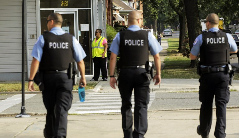 FILE - In this Aug. 26, 2013 file photo, Chicago Police patrol the neighborhood in Chicago. The American Civil Liberties Union of Illinois says that Chicago police officers are employing the controversial "stop and frisk" practice more than officers in New York City, where a judge ruled the widespread practice discriminated against minorities. In a study released Monday, March 23, 2015 the ACLU says that Chicago officers last summer conducted more than 250,000 stops of people who weren't arrested.