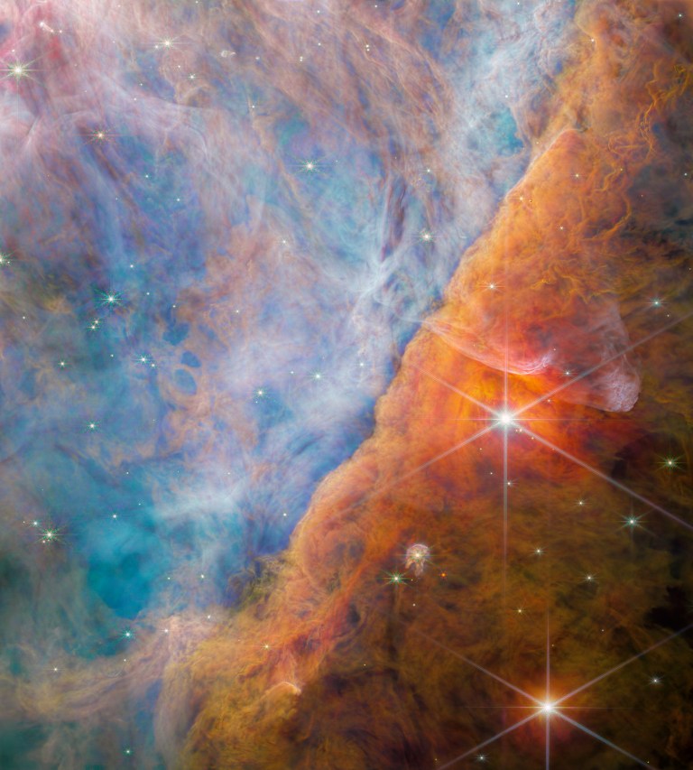 A part of the Orion Nebula known as the Orion Bar captured by the NIRCam (Near-Infrared Camera) on NASA's James Webb Space Telescope.