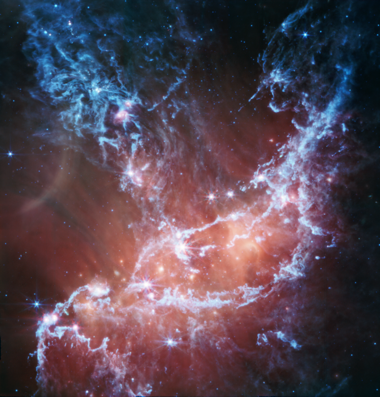 An infrared image of NGC 346 from NASAâs James Webb Space Telescopeâs Mid-Infrared Instrument traces emission from cool gas and dust.