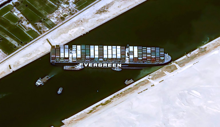 This satellite image from Cnes2021, Distribution Airbus DS, shows the cargo ship MV Ever Given stuck in the Suez Canal near Suez, Egypt, Thursday, March 25, 2021. The skyscraper-sized cargo ship wedged across Egypt's Suez Canal further imperiled global shipping Thursday as at least 150 other vessels needing to pass through the crucial waterway idled waiting for the obstruction to clear, authorities said.