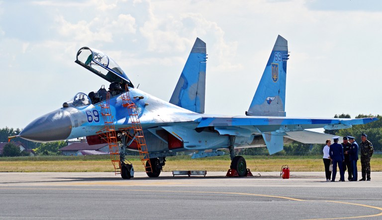 A Ukrainian Su-27UB aircraft is shown.