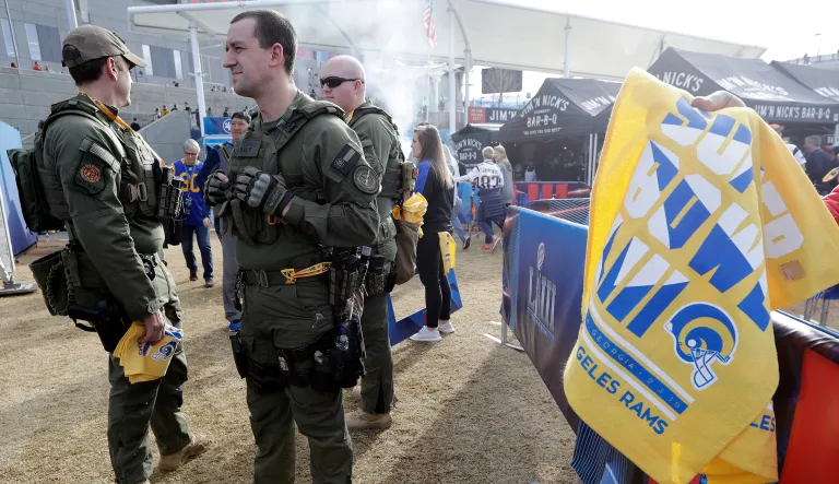 Law enforcement watches over the outdoor pre-game activities before the NFL Super Bowl 53 football game between the Los Angeles Rams and the New England Patriots Sunday, Feb. 3, 2019, in Atlanta.