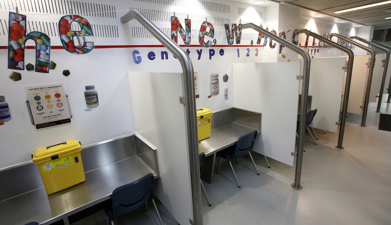 FILE - In this April 12, 2016, file photo, containers for used needles and drug use information are provided at each of the injecting cubicles at Sydney's Medically Supervised Injecting Centre in Sydney, Australia. Some lawmakers, activists and medical groups in Massachusetts are pushing for the creation of "supervised injection sites" where drug users can shoot up illegal substances under the watchful eye of staff trained in countering the effect of potentially fatal overdoses. Injection sites are already legal in a number of countries including Australia, Canada, France and Spain.