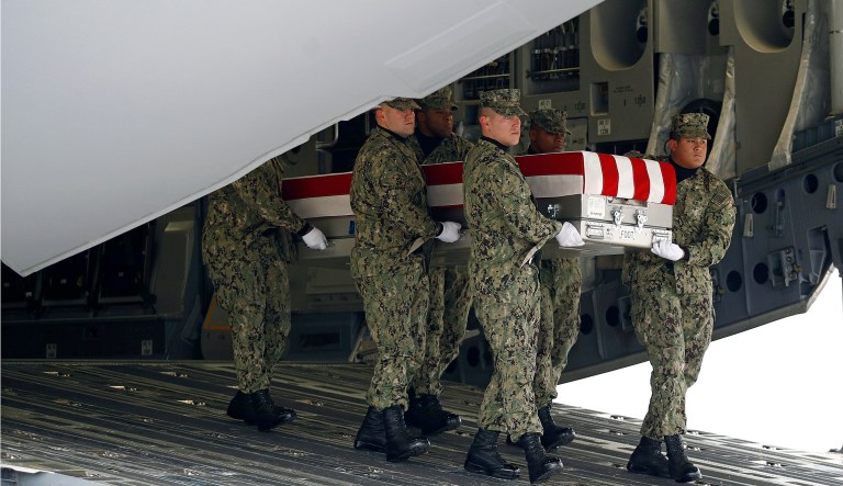 A U.S. Navy carry team moves a transfer case containing the remains of Scott A. Wirtz, Saturday, Jan. 19, 2019, at Dover Air Force Base, Del. According to the Department of Defense, Wirtz, a civilian and former Navy SEAL from St. Louis, Mo., was killed Jan. 16, 2019, in a suicide bomb attack in Manbij, Syria.
