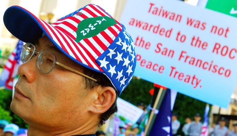 About 200 Taiwanese protest outside the de facto U.S. Embassy in Taipei, Taiwan, on Monday, Oct. 1, 2007, to demand that the U.S. grant them passports and citizenship. They claimed the 1951 San Francisco Peace Treaty handed Taiwan over for U.S. governance after World War II  ended Japan's 50-year colonization of this island, and that Taiwan has since remained U.S.-controlled territory.