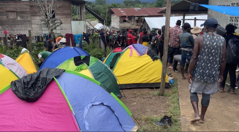 A migrant tent city has sprung up in a village outside the Darien Gap