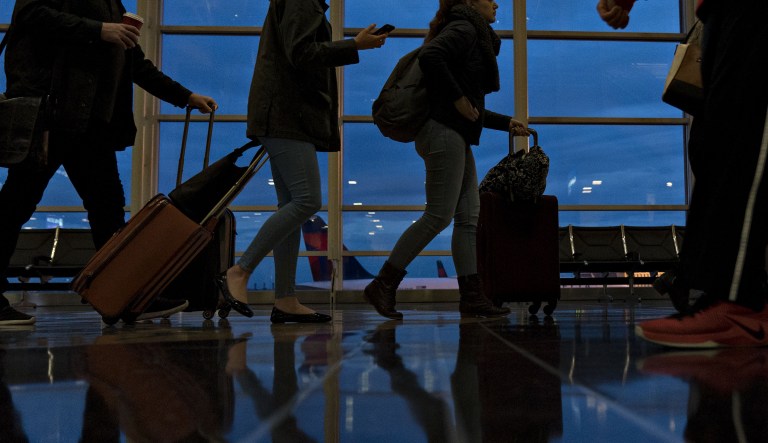 Travelers wait in line before going through Transportation Security Administration (TSA) screening at Ronald Reagan National Airport (DCA) in Washington, D.C.