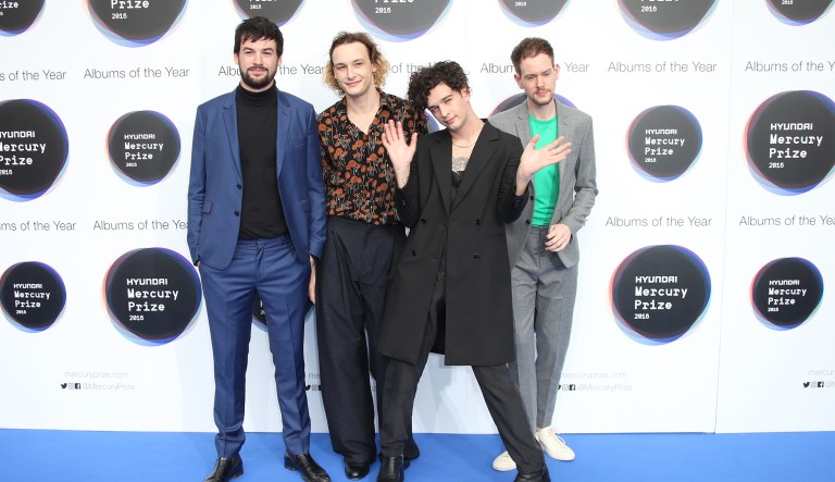 Members of the band 'The 1975' from left, Ross McDonald, George Daniel, Matthew Healy and Adam Hann pose for photographers upon arrival at the Mercury Prize Albums of the Year event in London, Thursday, Sept. 15, 2016.