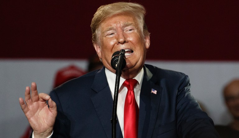 President Donald Trump gestures as he speaks at a rally at Olentangy Orange High School in Lewis Center, Ohio, Saturday, Aug. 4, 2018. 