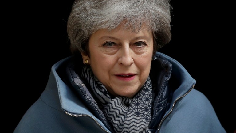 British Prime Minister Theresa May leaves 10 Downing Street in London, to attend the weekly Prime Minister's Questions at the Houses of Parliament, Wednesday, April 3, 2019. With Britain racing toward a chaotic exit from the European Union within days, May veered away from the cliff-edge Tuesday, saying she would seek another Brexit delay and hold talks with the opposition to seek a compromise.  