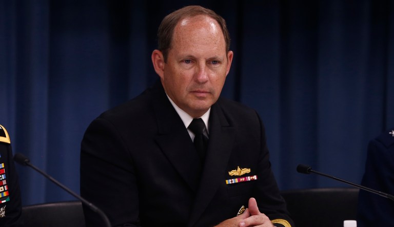 Navy Rear Adm. Tony Kurta listens during a news conference at the Pentagon in Washington, Tuesday, June 18, 2013.The military services announced their plans to break down the final barriers for women, opening up thousands of combat jobs including the elite Army Rangers and Navy SEAL.