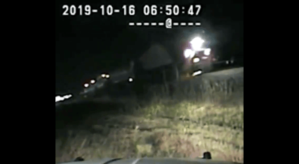 WATCH: Hero state trooper pulls unconscious driver from car seconds before it is hit by train