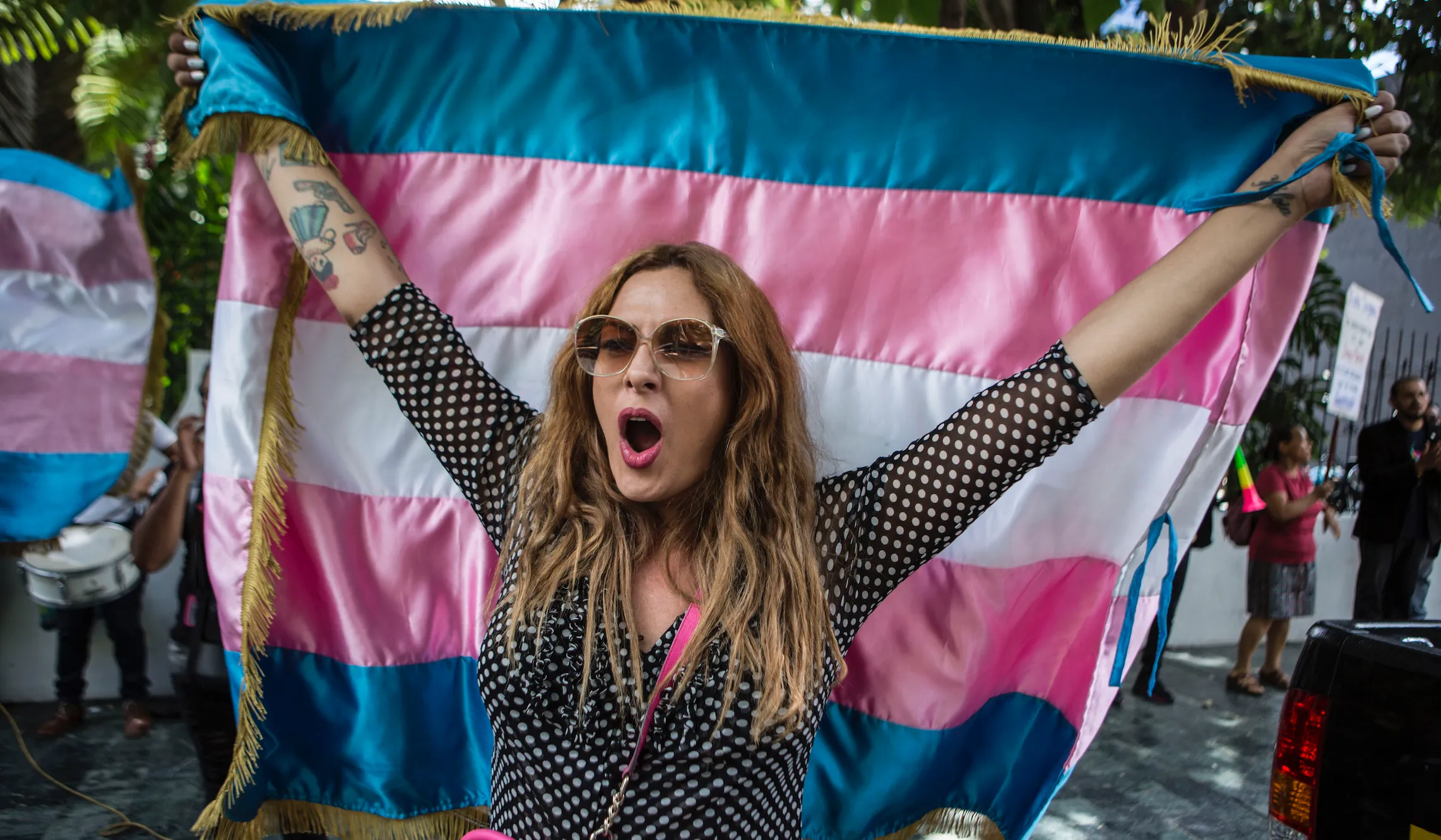 Protesters mob elderly woman who confronted transgender woman in locker room