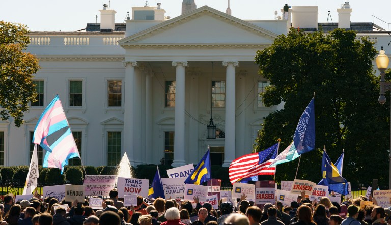 The National Center for Transgender Equality, NCTE, and the Human Rights Campaign gather on Pennsylvania Avenue in front of the White House in Washington, Monday, Oct. 22, 2018, for a #WontBeErased rally. 