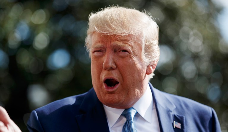 President Donald Trump talks to reporters on the South Lawn of the White House, Friday, Oct. 4, 2019, in Washington.