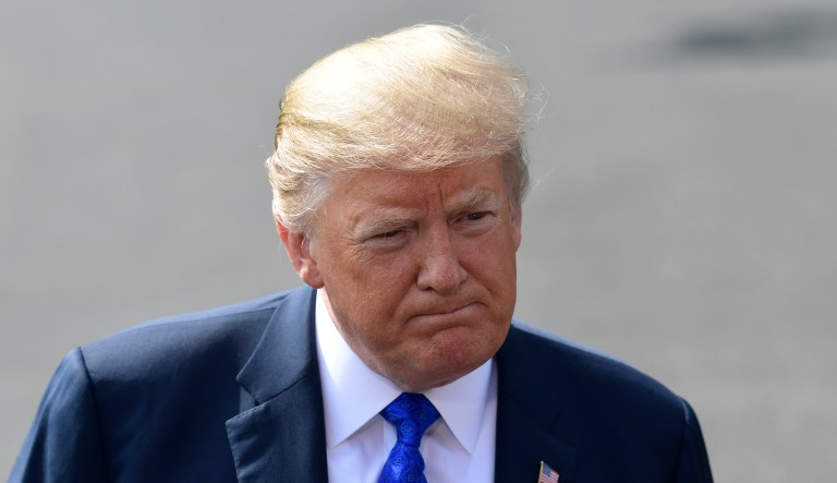 President Donald Trump talks with reporters on the South Lawn of the White House in Washington, Tuesday, Oct. 2, 2018.