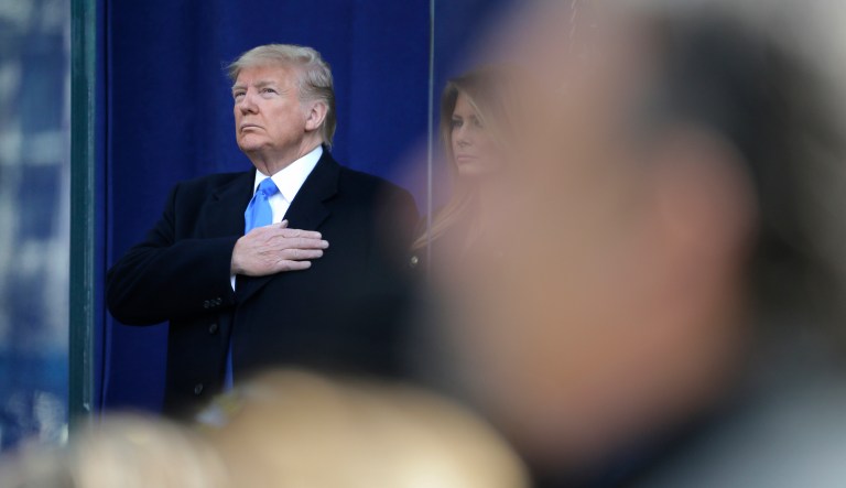 President Donald Trump puts his hand over his heart during a wreath laying ceremony at the opening ceremony of the New York City Veterans Day Parade in New York, Monday, Nov. 11, 2019.