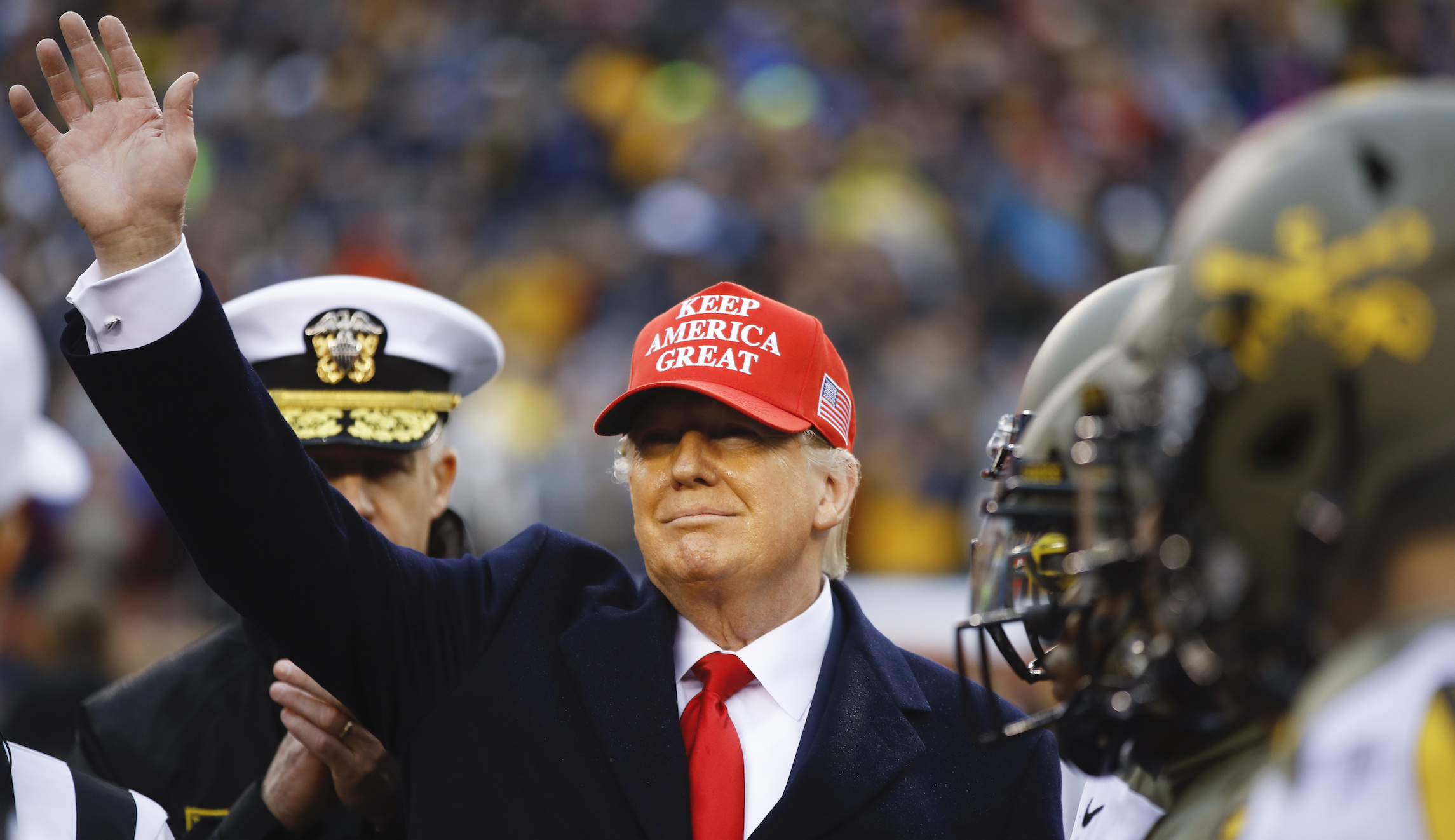 Donald Trump arrives to huge cheers at Army-Navy football game