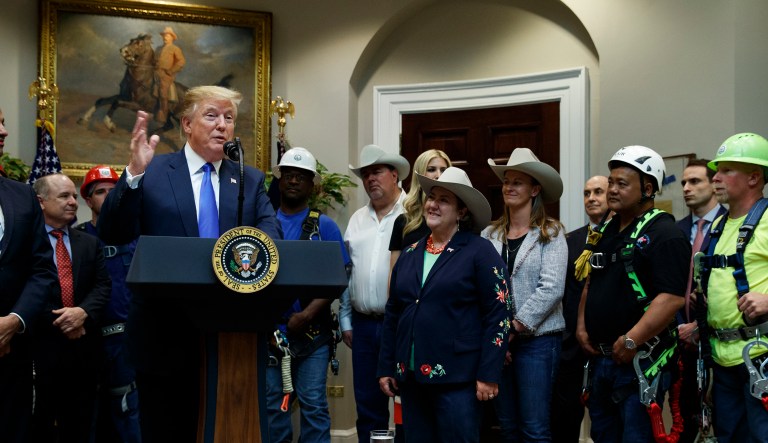 President Donald Trump gestures as he speaks about the deployment of 5G technology in the United States during an event in the Roosevelt Room of the White House, Friday, April 12, 2019, in Washington.