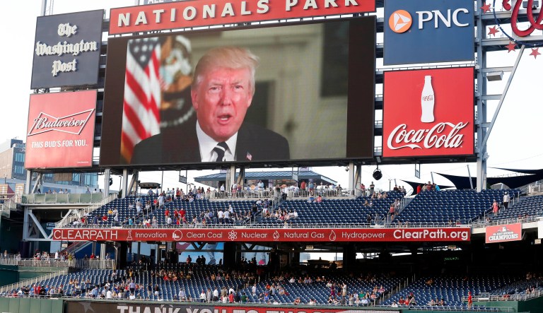 A message from President Donald Trump is shown on the video board before the Congressional baseball game, Thursday, June 15, 2017, in Washington. The annual GOP-Democrats baseball game raises money for charity.