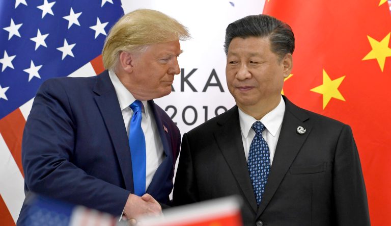 ** HOLD FOR STORY CHINA US TRADE BEIJING'S CALCULATION BY JOE MCDONALD ** FILE - In this Saturday, June 29, 2019, file photo, President Donald Trump, left, shakes hands with Chinese President Xi Jinping during a meeting on the sidelines of the G-20 summit in Osaka, Japan.