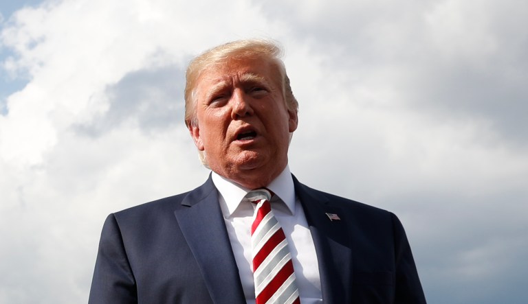 President Donald Trump, with first lady Melania Trump, speaks to the media before boarding Air Force One in Morristown, N.J., Sunday, Aug. 4, 2019.
