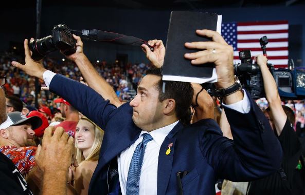 Trump campaign takes aide who blocked photographer ‘off the road’
