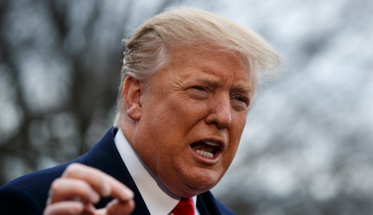 President Donald Trump talks with reporters before boarding Marine One on the South Lawn of the White House, Friday, March 22, 2019, in Washington.