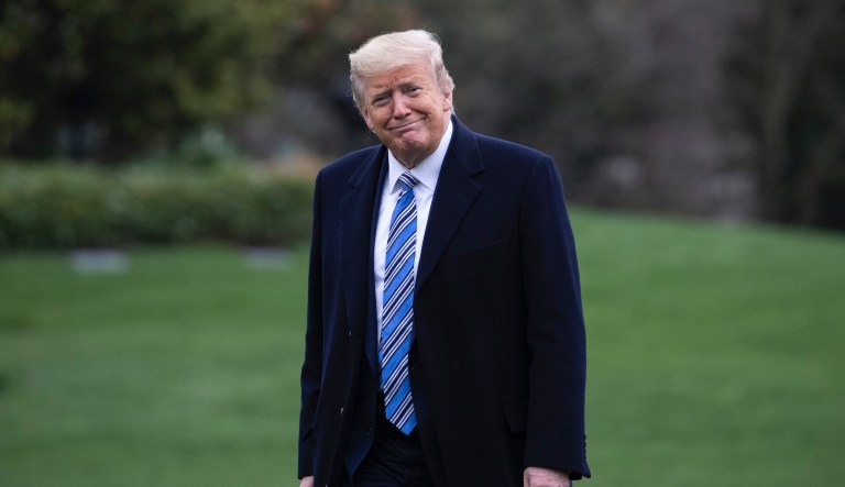 President Donald Trump smiles as he walks from Marine One after returning to the White House, Saturday, March 28, 2020, in Washington. Trump is returning from Norfolk, Va., for the sailing of the USNS Comfort, which is headed to New York.              