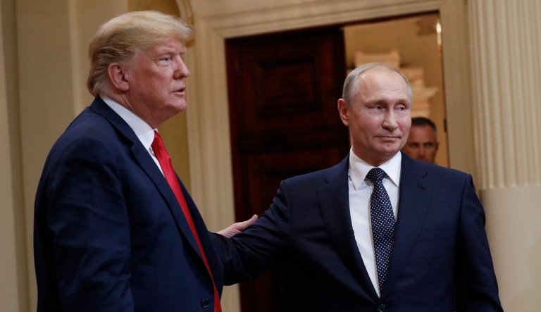 U.S. President Donald Trump, left, and Russian President Vladimir Putin, right, leave the stage together at the conclusion of their joint news conference at the Presidential Palace in Helsinki, Finland, Monday, July 16, 2018.