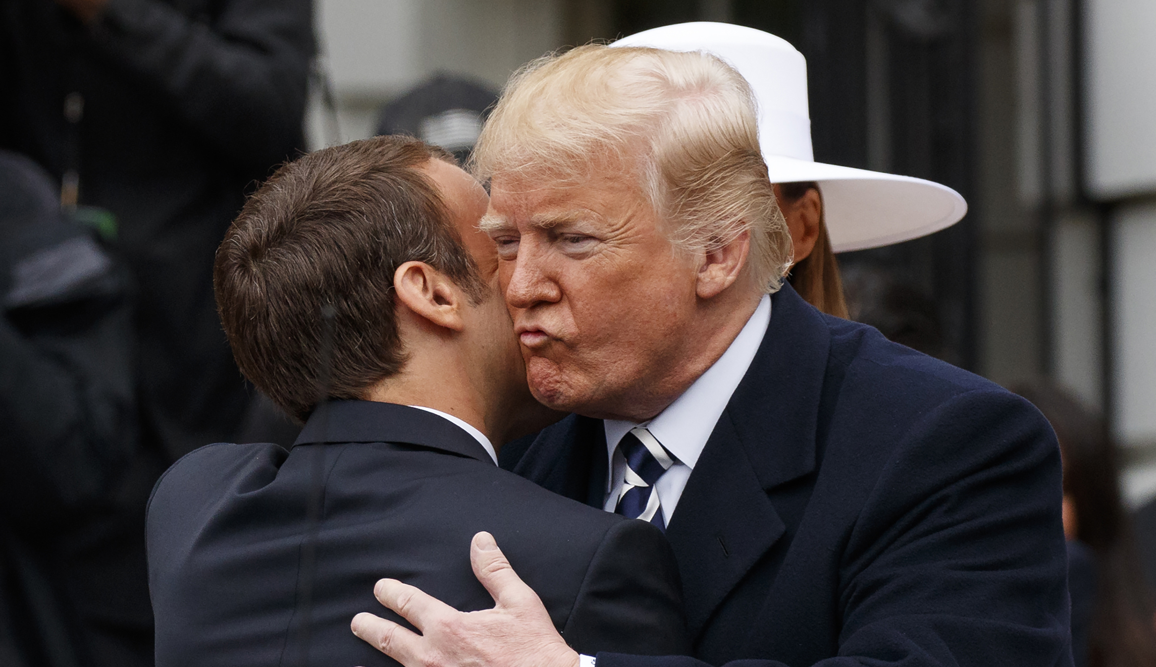 Trump gets a French kiss at the White House