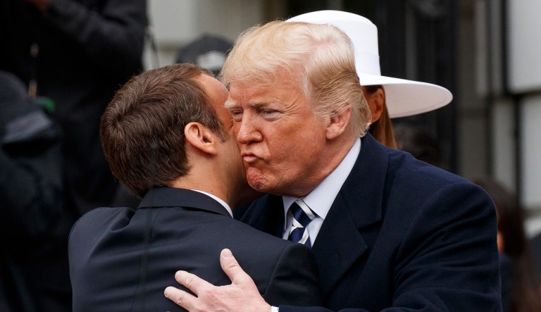 President Donald Trump greets French President Emmanuel Macron as he arrives for a State Arrival Ceremony on the South Lawn of the White House in Washington, Tuesday, April 24, 2018.