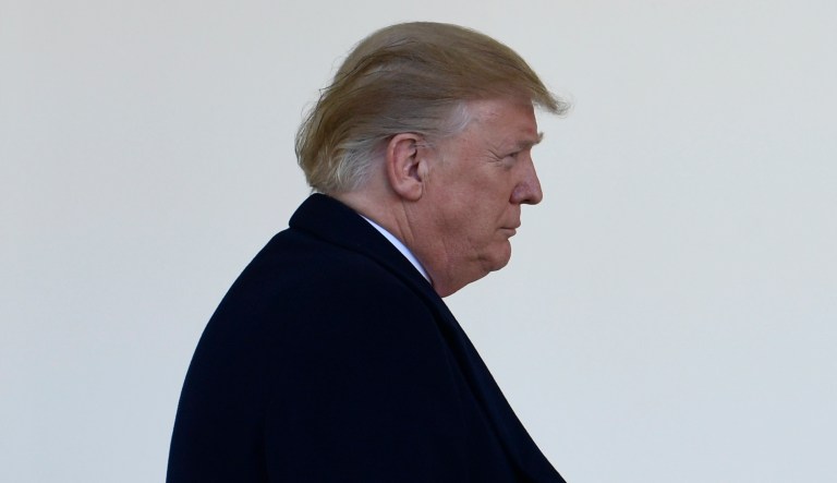 President Trump walks to the Rose Garden of the White House in Washington, Friday, Jan. 25, 2019, to announce a temporary deal to open the government.