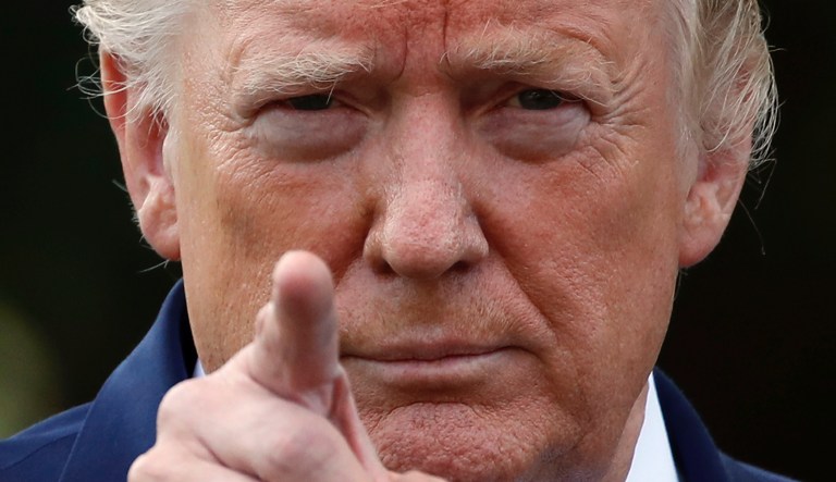 President Donald Trump points to a reporter for a questions as he speaks with reporters on the South Lawn of the White House before departing, Friday, July 19, 2019, in Washington. 