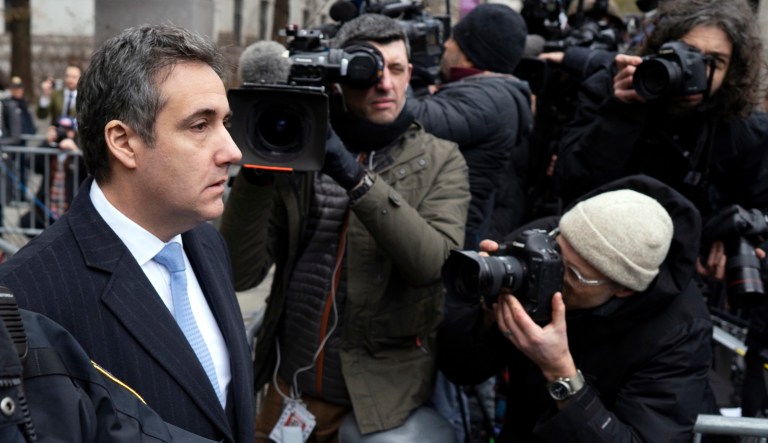 Michael Cohen walks from federal court Wednesday, Dec. 12, 2018, in New York, after he was sentenced following a guilty plea for lying to Congress, campaign finance violations and other crimes.
